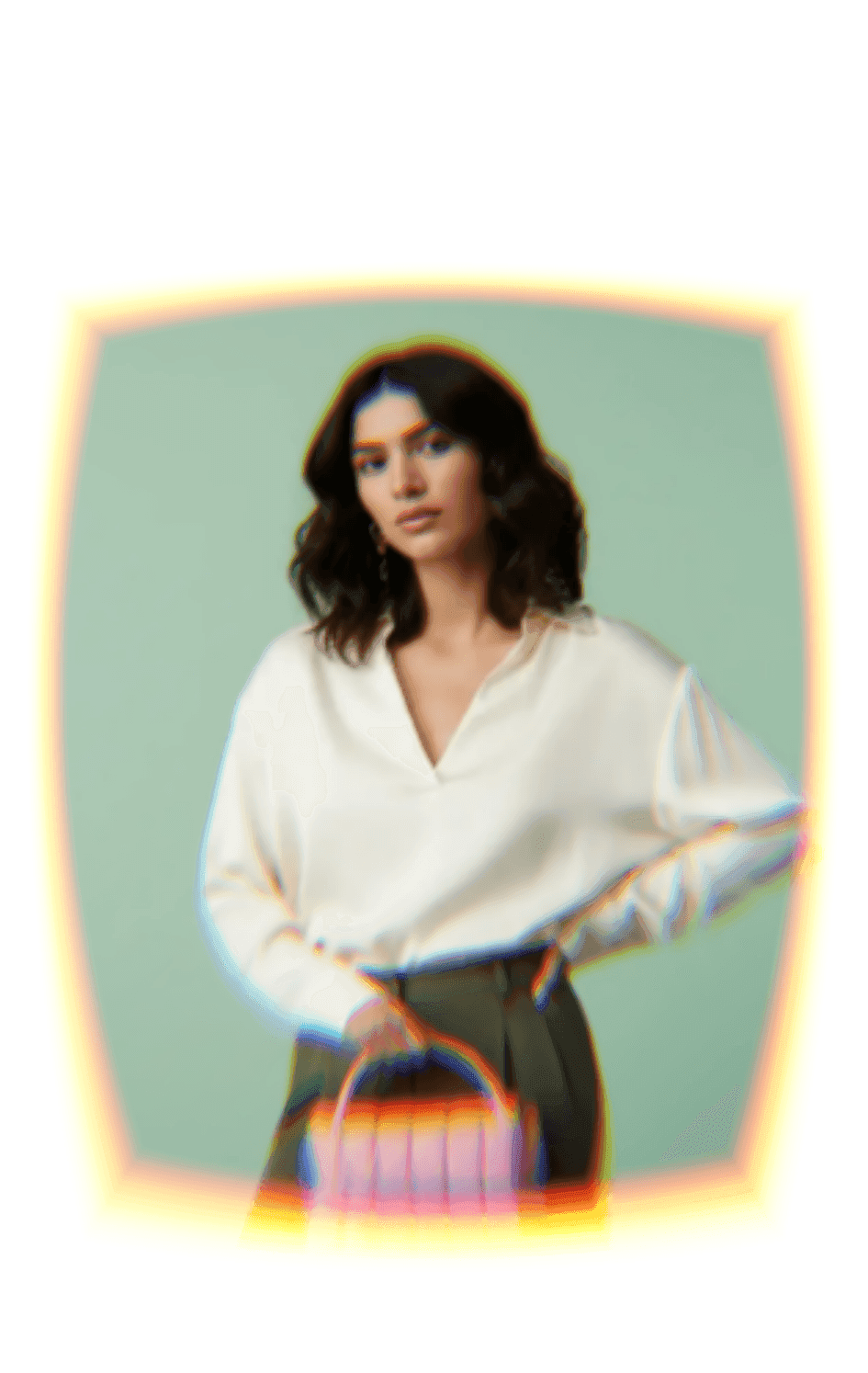 A catalogue image produced by Dekhlo from a single source photo: a model in a cream blouse and olive trousers against a soft green studio backdrop.