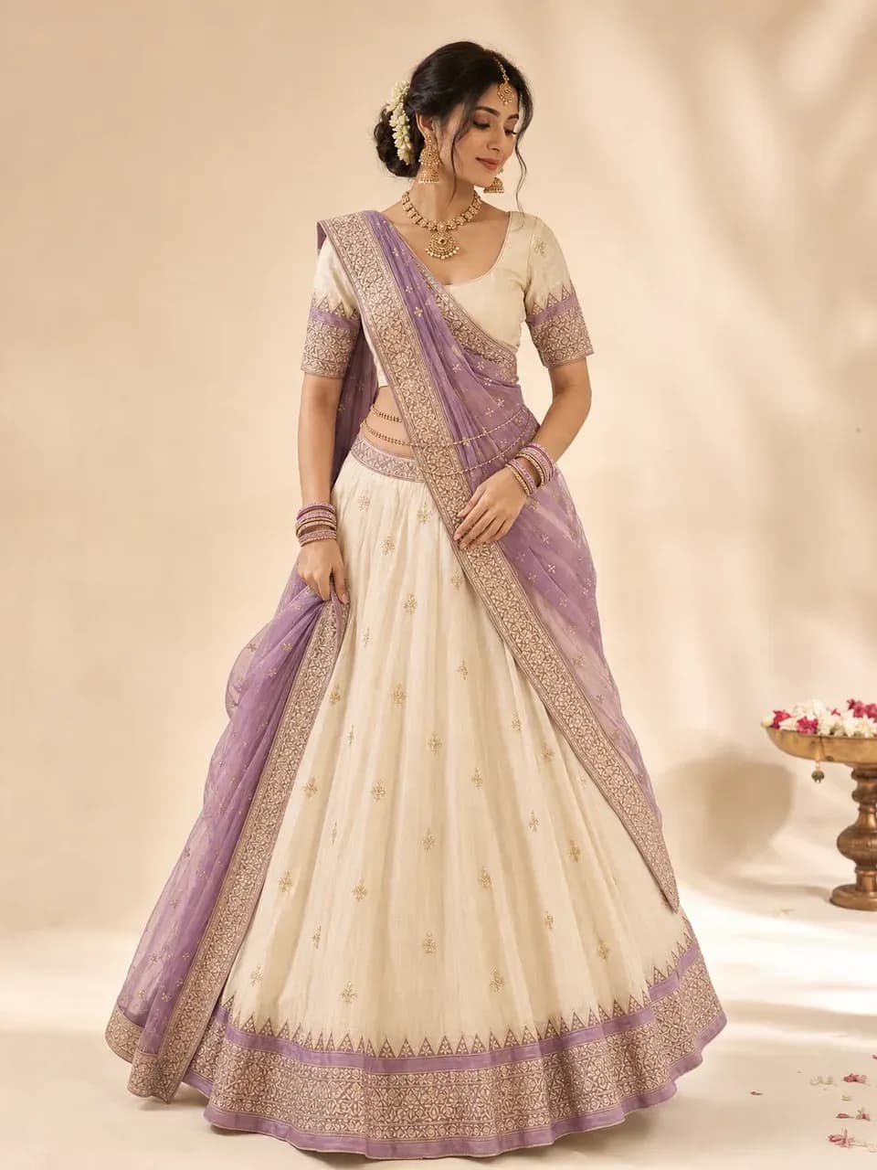 An ivory and lilac lehenga on a model against a plain studio backdrop, generated sample